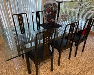 Black steel and glass dining table by Cassina after Le Corbusier - excellent condition (28" x 88" x 39.5") and shown with black leather and and metal side chairs (6) designed after Joseph Hoffman (39.25" x 17.5" x 17.5")