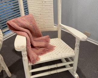 Ivory painted wicker rocker - some distressing - good condition, shown with peach and green wool throw blanket