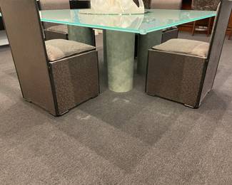 Another view of the glass and steel dining table by Lella and Massimo Vignelli: 4 pedestals steel and glass top: 72" square x 1" - shown with custom upholstered parsons chairs with leather trim and down cushions (8)