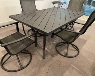 Patio dining table - gray metal - with 4 chairs - gray metal base (rocker) and tan mesh - pair of tables availalbe - very good condition