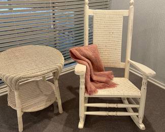 Ivory painted wicker rocker - some distressing - good condition and Ivory wicker 25" round side table with lower tier -(25" x 25") good condition - some wear