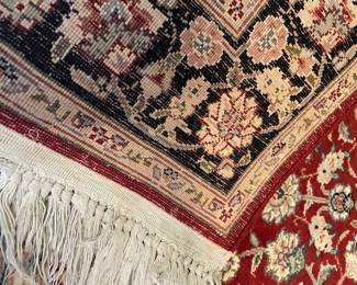 back view of the Kashan style 100% wool area rug with center medallion with multiple boarders - hand-made with hand-tied fringe (5' x 3') - excellent condition