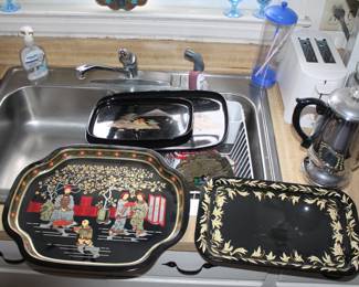 several vintage serving trays