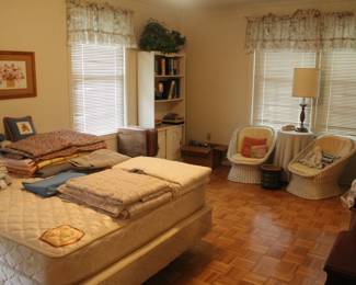 Vintage wicker chairs and nice wooden book shelf