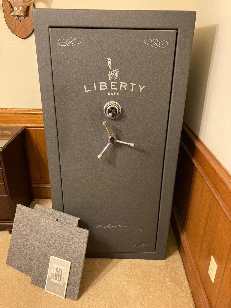 Huge gun safe with combination and manual.