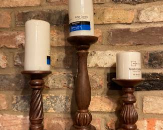 We have several candles and candleholders.