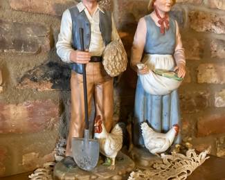 There are several antique figurines and statues in the sale.