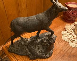 The Den bookcase has several statues like this for sale.