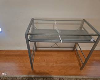 Metal computer desk with glass top and keyboard slide out