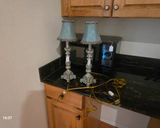 Small microwave and candle stick lamps