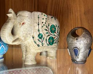 Collectibles from Asia, India and Persia including a marble elephant with stone inlay and a silver seal ring with lapis lazuli 