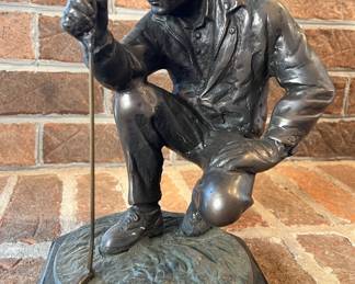 Bronze kneeling golfer statue