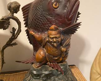 Closeup of some of the items on cabinet just inside front door 