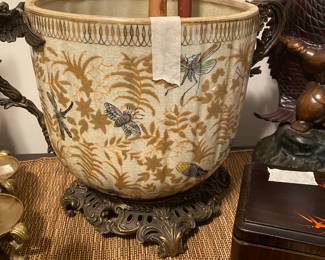 Closeup of some of the items on cabinet just inside front door 