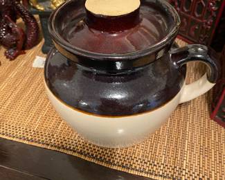 Closeup of some of the items on cabinet just inside front door 