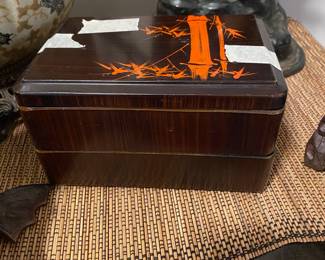 Closeup of some of the items on cabinet just inside front door 