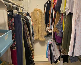 Women’s Clothing in bedroom closet 