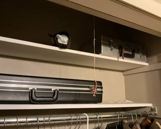 Briefcases in top of closet
