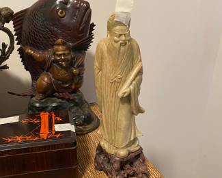 Closeup of some of the items on cabinet just inside front door 