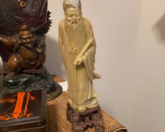 Closeup of some of the items on cabinet just inside front door 