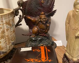 Closeup of some of the items on cabinet just inside front door 