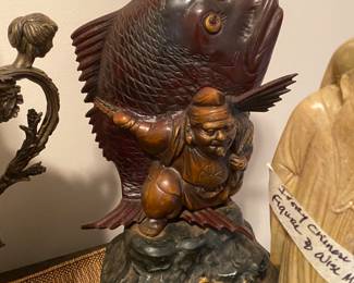 Closeup of some of the items on cabinet just inside front door 