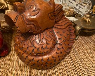 Closeup of some of the items on cabinet just inside front door 