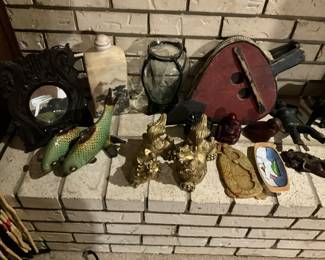 Fireplace in Family room with unique collectible items 