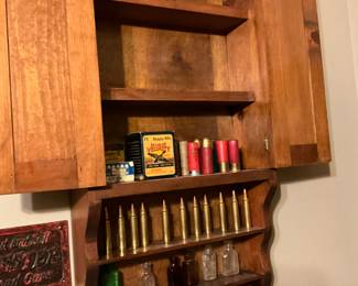 More items in cabinet - man room 