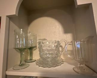 Items in dining area of kitchen -,middle bud vintage Fostoria pitcher & 2 salad plates 