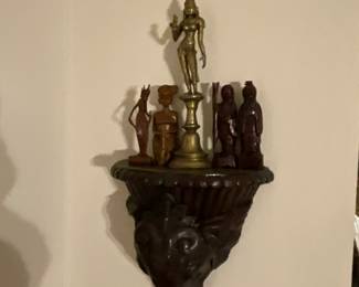 Wall sconce with figurines 