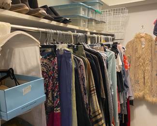 Women’s Clothing in bedroom closet 