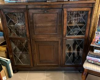 Cabinet in Sunroom - by is inside and on top