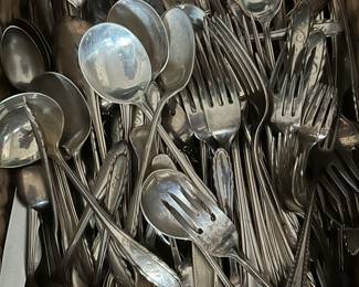 Large sterling flatware set in the Lyric pattern
