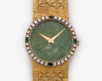 64. 18K Piaget Diamond + Emerald Watch