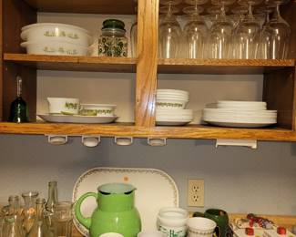 Casserole dishes are by GlasBake. Dishes are Corelle Spring Blossom green. Various green glassware to go along with the Corelle. 