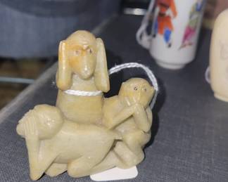 Hear, see, speak no evil monkey figurine.