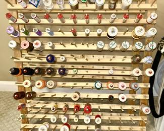 Two wooden thread holders, just a small sample of thread available