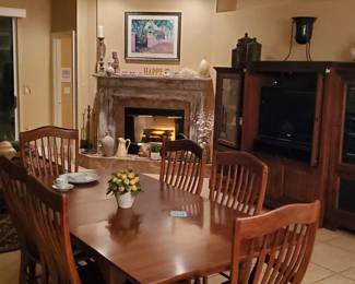 Nichols and Stone Dining table with 4 chairs, 2 Captains chairs, 2, 15" leaves and protective pads.