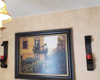Esquina Al Mar by Montserrat Masdeu Framed Art, flanked by a pair of Country Candle Sconces