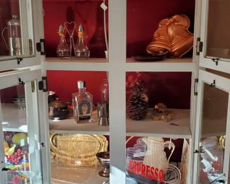 Kitchen curio cabinet full of vintage service ware and kitchen ware