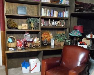 Vintage Leather Club Chair.  The Living Bible Encyclopedia set in story and pictures. Golf ball trophy.  Vintage Mark Twain 6 Novels books. Vintage 1920s violin.  Christian cross framed art. Sakura Anibal print accent plate. Christmas decor. Vintage artemesia floral arrangement in vase. Collection of wooden horses. Vintage Tiffany Lotus and Dragon fly stained glass lamp. Colourful Tiffany stained glass lamp, art deco style, 1970s. Pathos decorative plan in basket. 