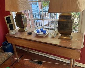 Drop leaf table (not perfect condition) priced as is. 
Brass lamps Guest house 