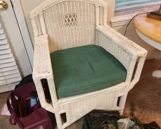 One of four wicker side chairs