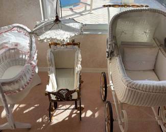 Three Baby Carriages With Wheels And Rolls White Wicker Basket Baby Carriages And Carriers