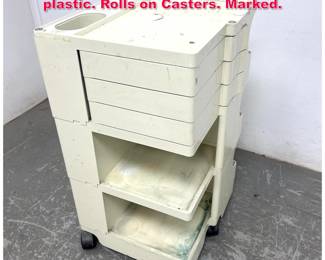Lot 349 Joe Colombo Bobby Cart. White plastic. Rolls on Casters. Marked.