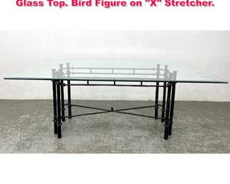 Lot 174 Goor inspired Iron Dining Table. Glass Top. Bird Figure on X Stretcher.