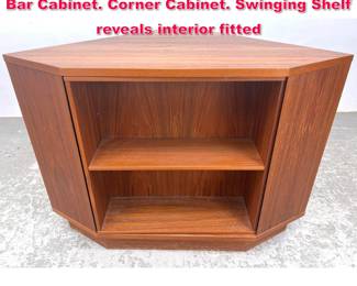 Lot 588 HAPPY VIKING Danish Modern Teak Bar Cabinet. Corner Cabinet. Swinging Shelf reveals interior fitted