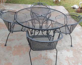 wrought iron table and four chairs