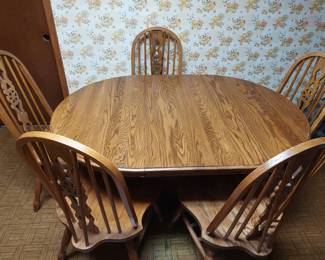 oak table with five matching chairs